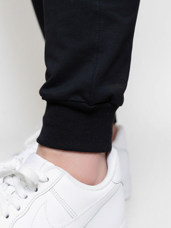 jogging sarouel noir de profil élastique